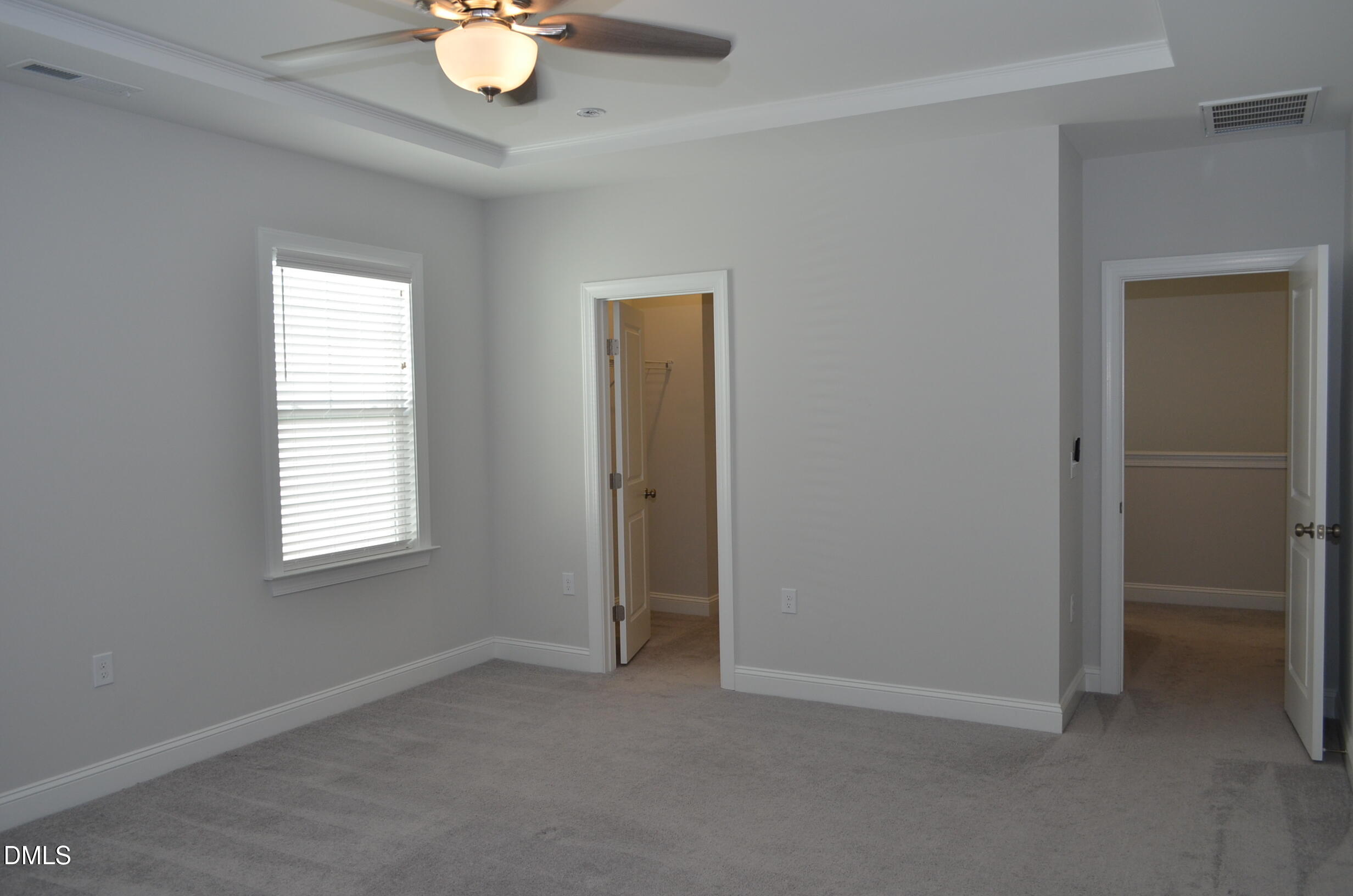 268 Edge Of Auburn Boulevard Raleigh, NC 27610 - Photo 27 of 36 an empty room with closet and a window