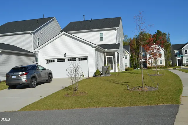 a view of a car park in front of house