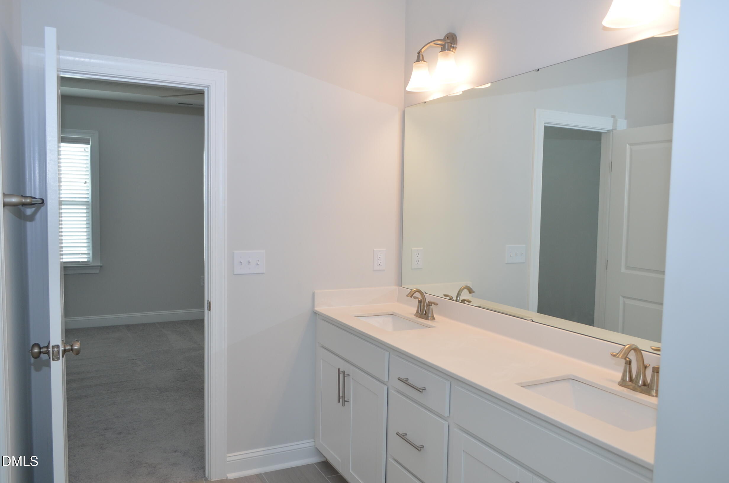 268 Edge Of Auburn Boulevard Raleigh, NC 27610 - Photo 32 of 36 a bathroom with a sink and a mirror