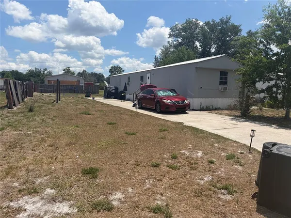 a view of a car parked in front of a house