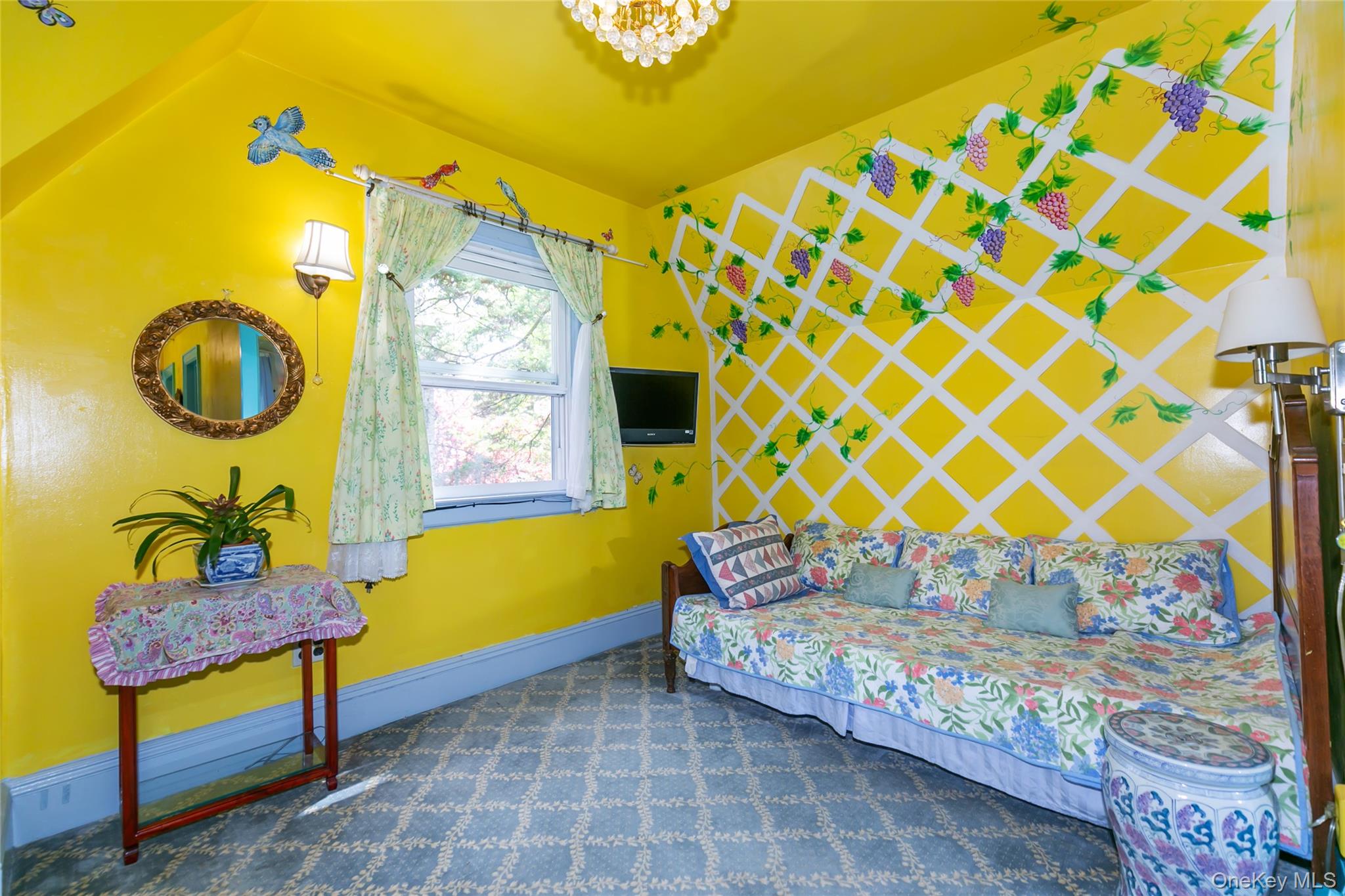 200 Myrtle Drive Great Neck, NY 11021 - Photo 13 of 25 a bedroom with a bed and a painting on the wall