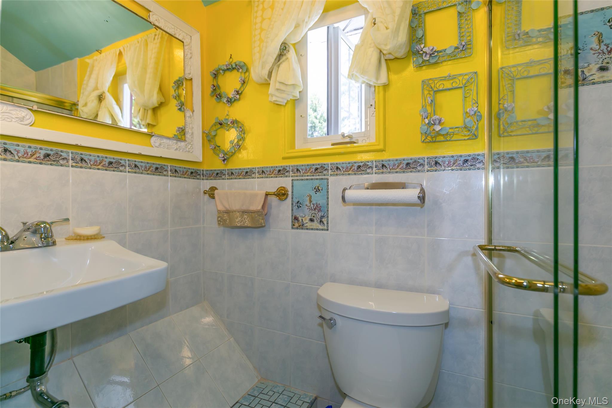 200 Myrtle Drive Great Neck, NY 11021 - Photo 15 of 25 a bathroom with a sink and a toilet