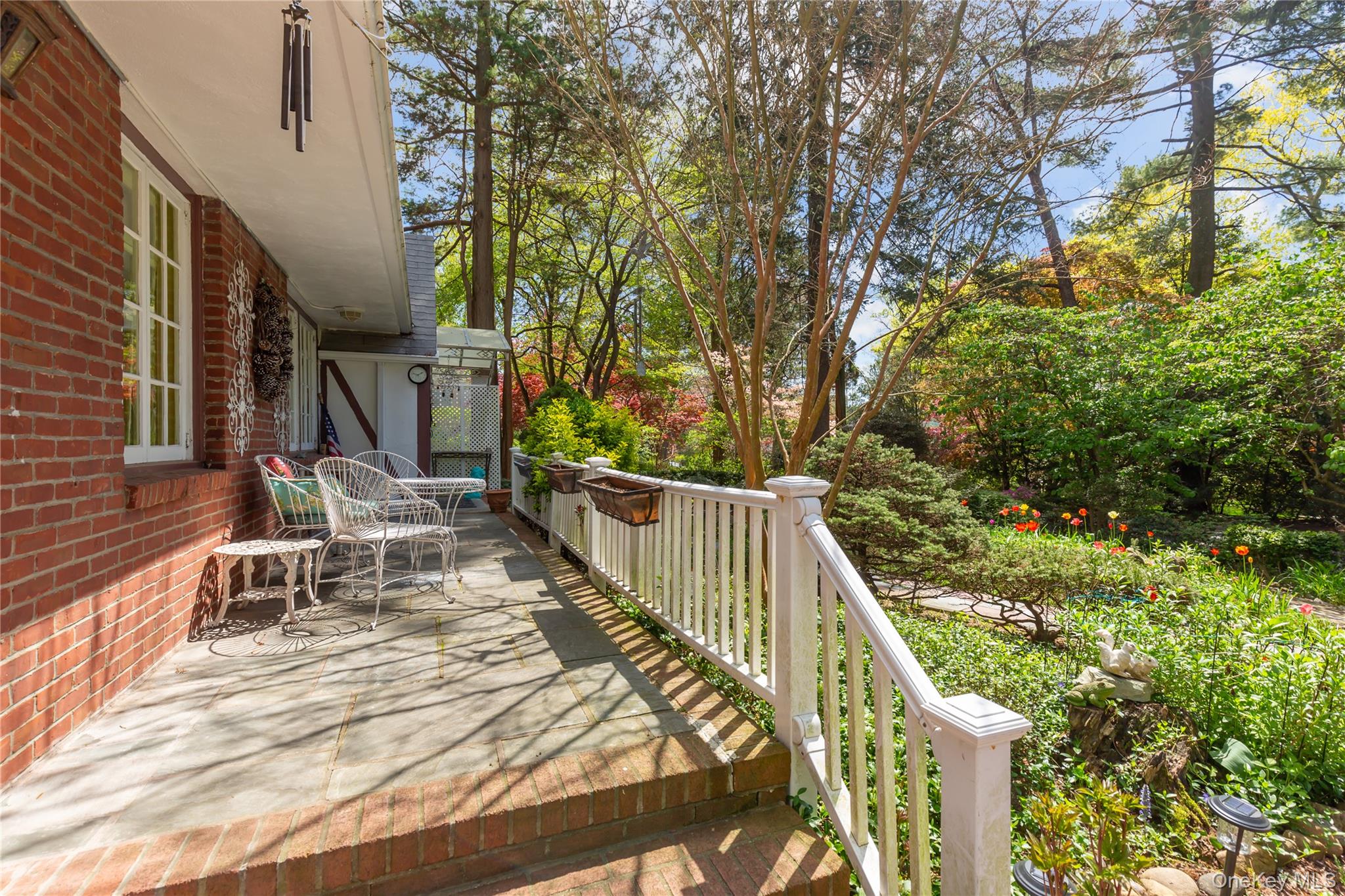 200 Myrtle Drive Great Neck, NY 11021 - Photo 20 of 25 a view of balcony with wooden floor and outdoor seating