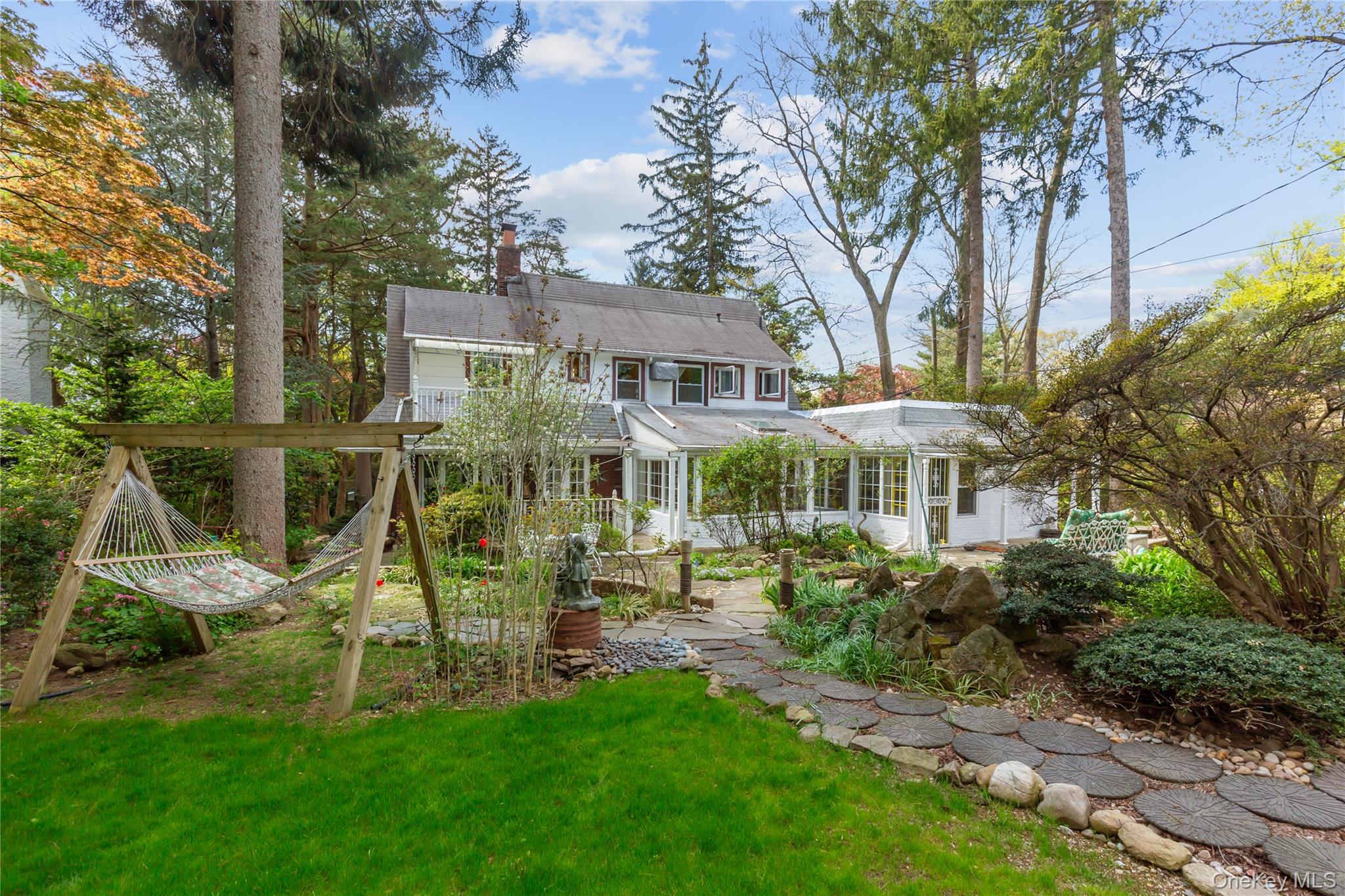 200 Myrtle Drive Great Neck, NY 11021 - Photo 21 of 25 a view of a house with a yard and sitting area