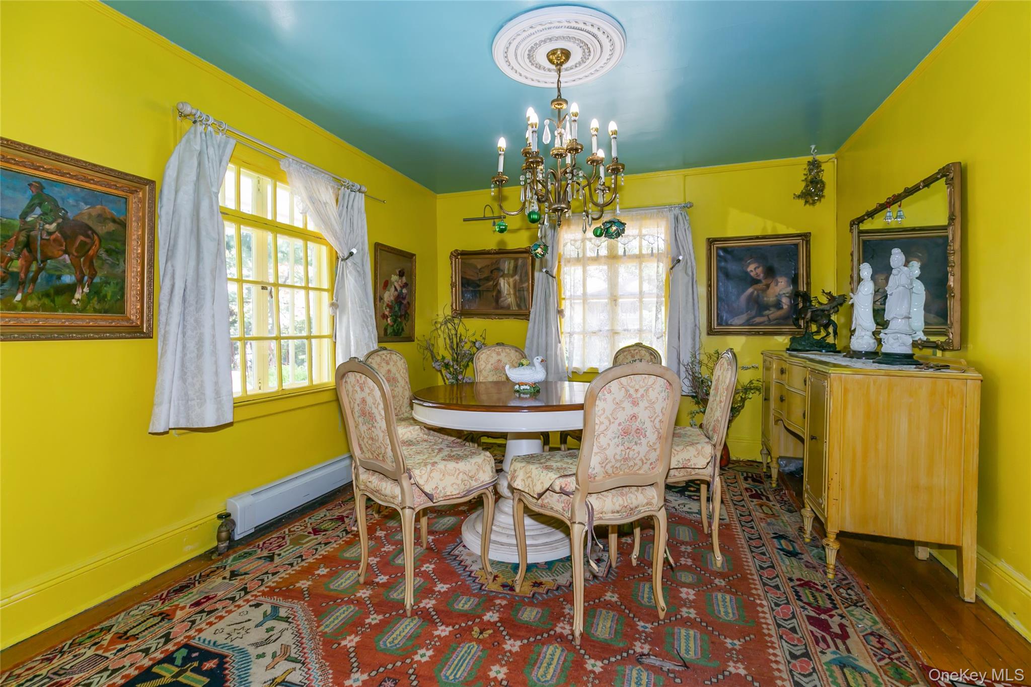200 Myrtle Drive Great Neck, NY 11021 - Photo 4 of 25 a dining room with furniture a chandelier and wooden floor