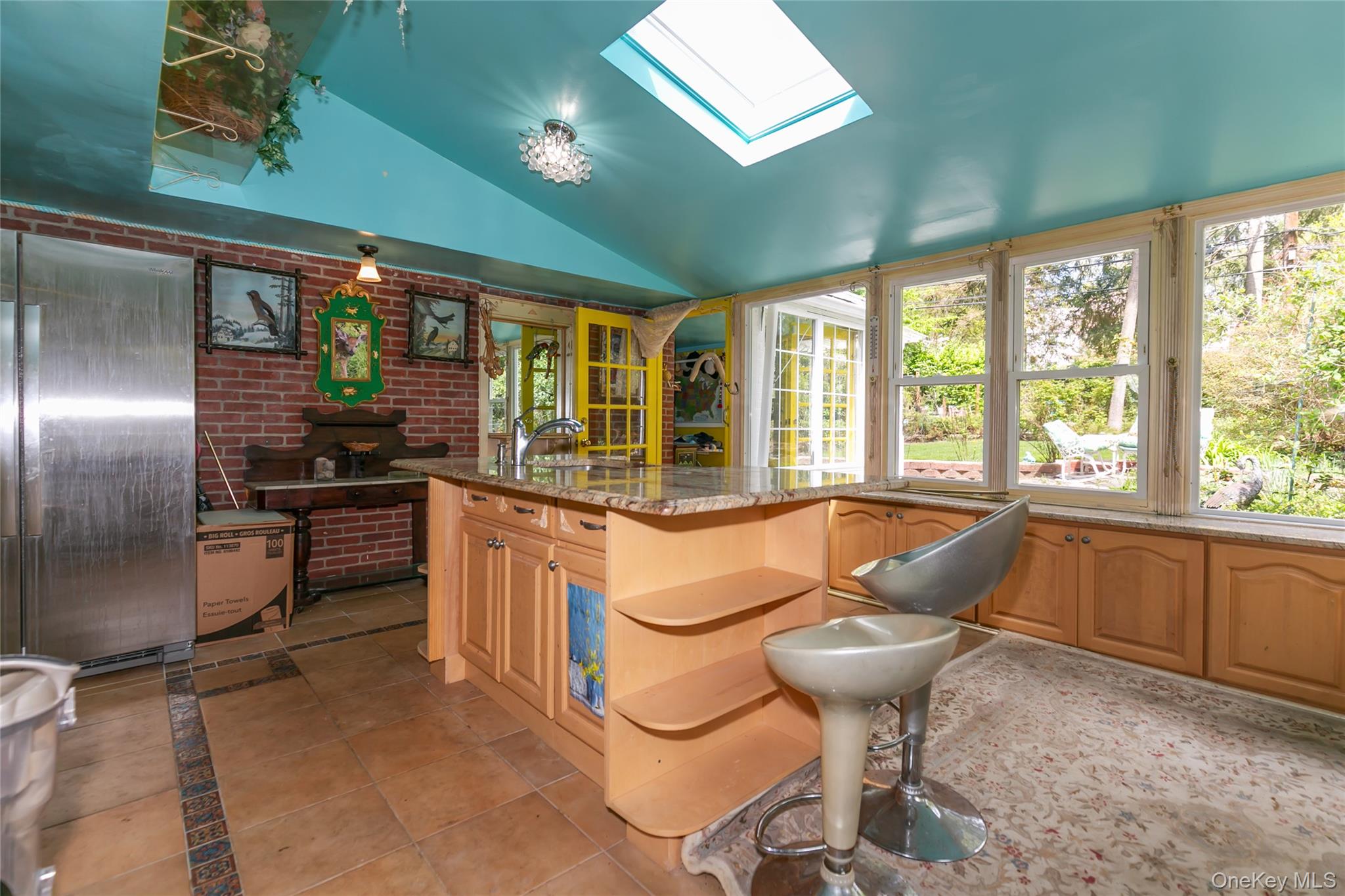 200 Myrtle Drive Great Neck, NY 11021 - Photo 5 of 25 a kitchen with stainless steel appliances kitchen island granite countertop a stove a sink and a refrigerator