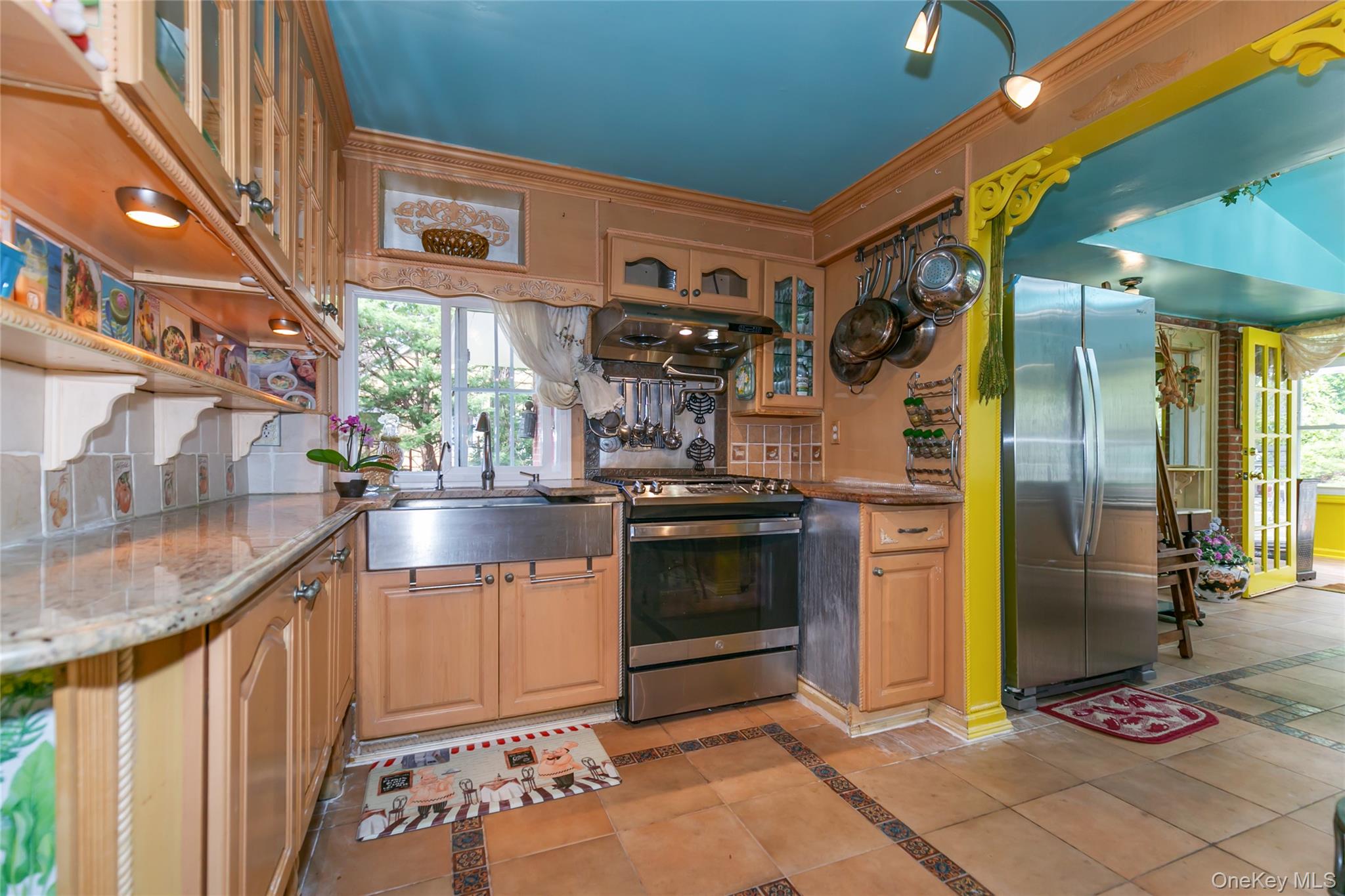 200 Myrtle Drive Great Neck, NY 11021 - Photo 7 of 25 a kitchen with stainless steel appliances granite countertop a refrigerator and a sink