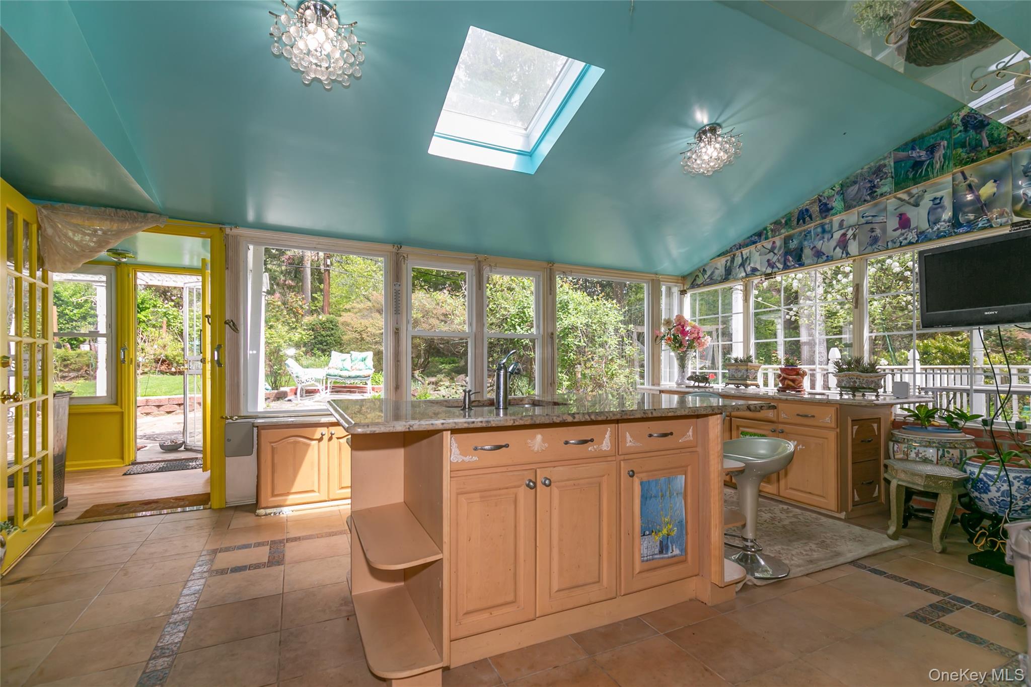 200 Myrtle Drive Great Neck, NY 11021 - Photo 8 of 25 a living room with granite countertop furniture a flat screen tv and floor to ceiling window