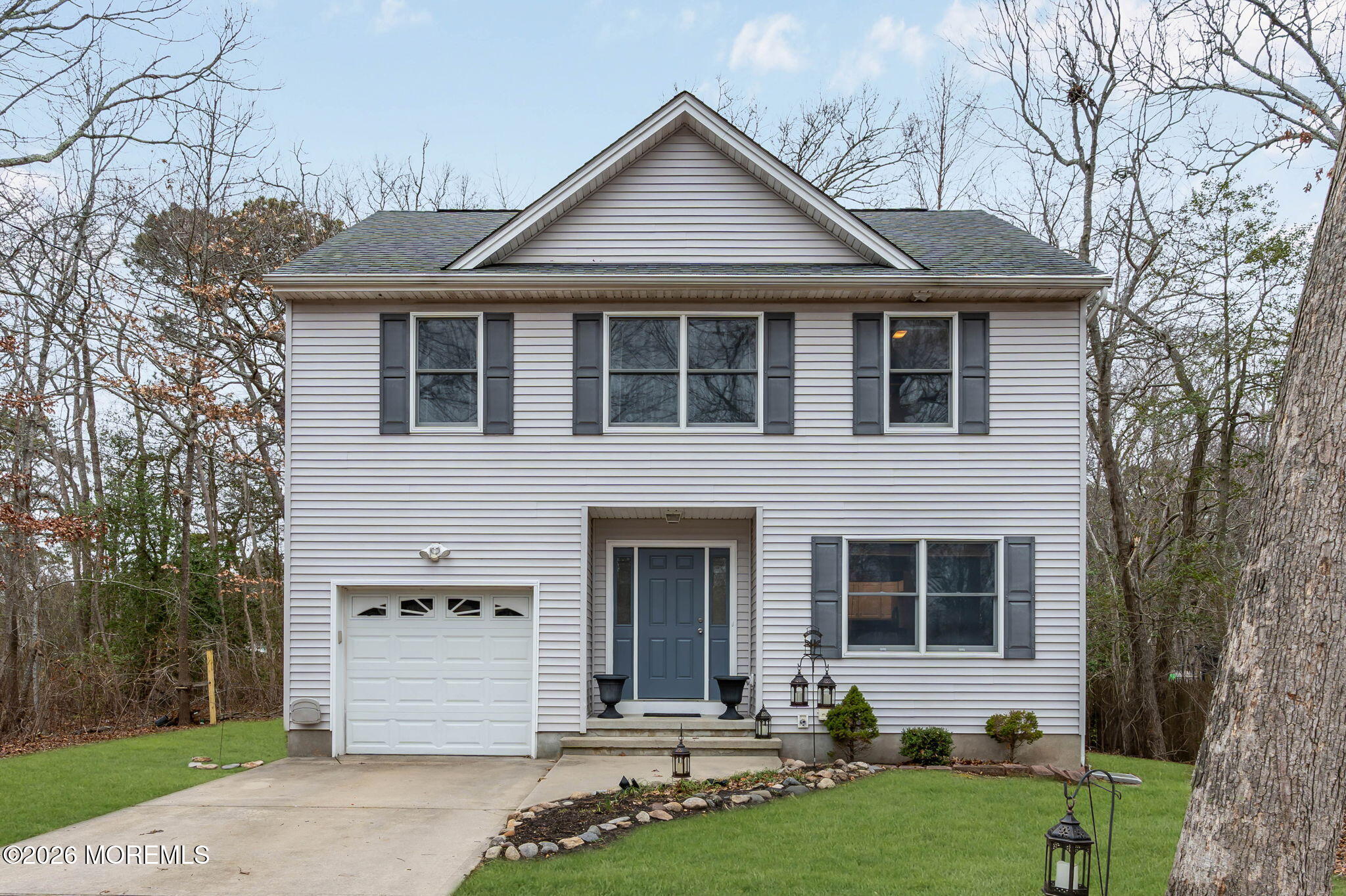 9 Forecastle Way Waretown, NJ 08758 - Photo 1 of 51 a front view of a house with a yard and garage