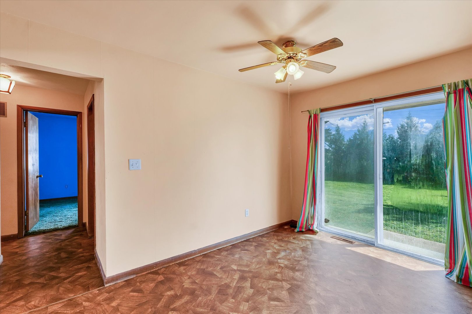 1512 Locust Avenue Rantoul, IL 61866 - Photo 11 of 39 a view of a livingroom with a ceiling fan and window