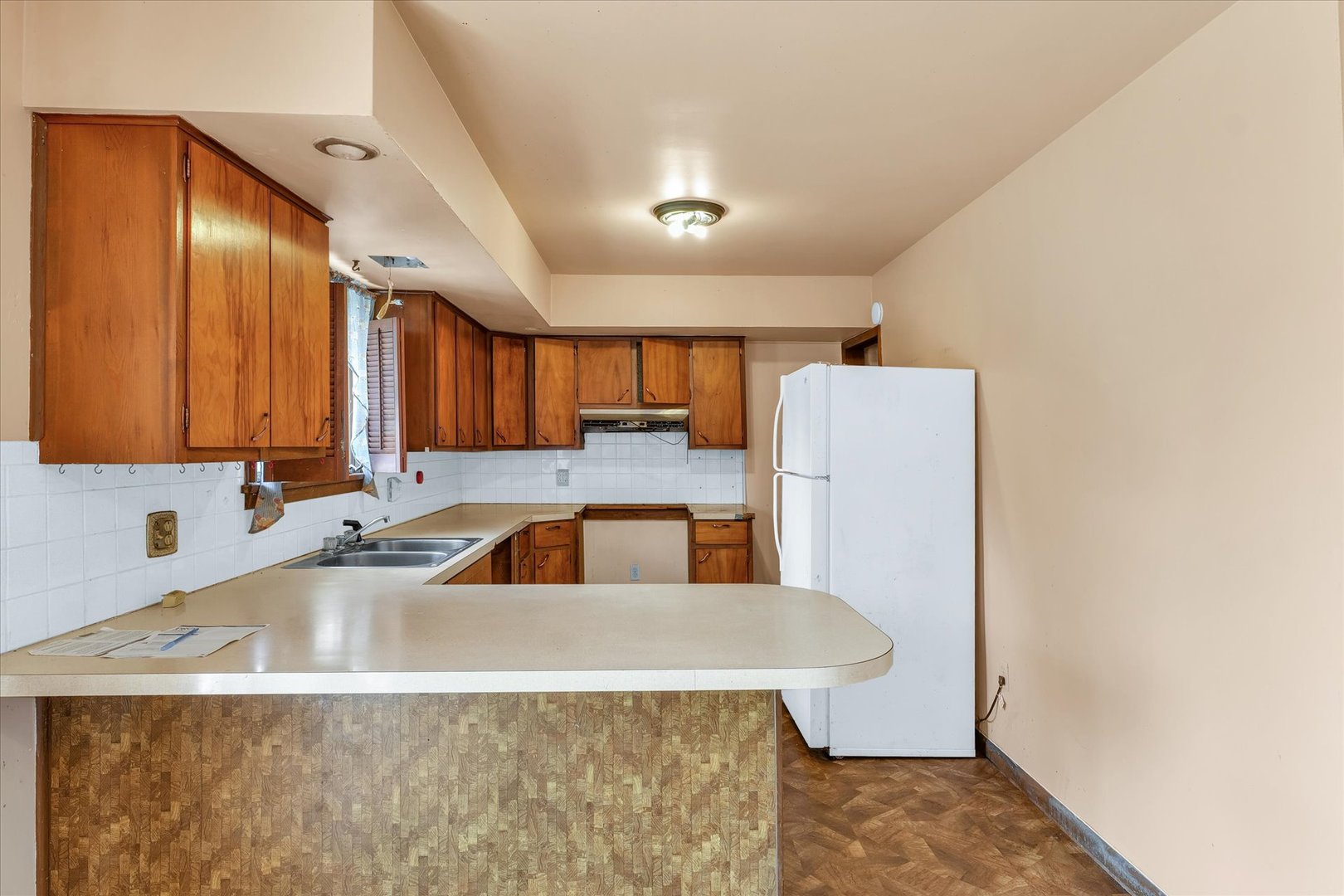 1512 Locust Avenue Rantoul, IL 61866 - Photo 12 of 39 a view of a kitchen with a sink and dishwasher with a dining table
