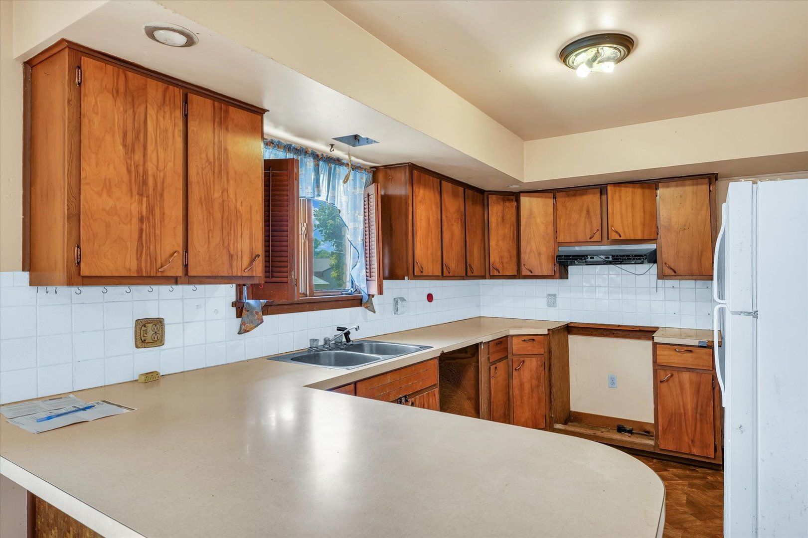 1512 Locust Avenue Rantoul, IL 61866 - Photo 13 of 39 a kitchen with stainless steel appliances a sink a stove and a refrigerator