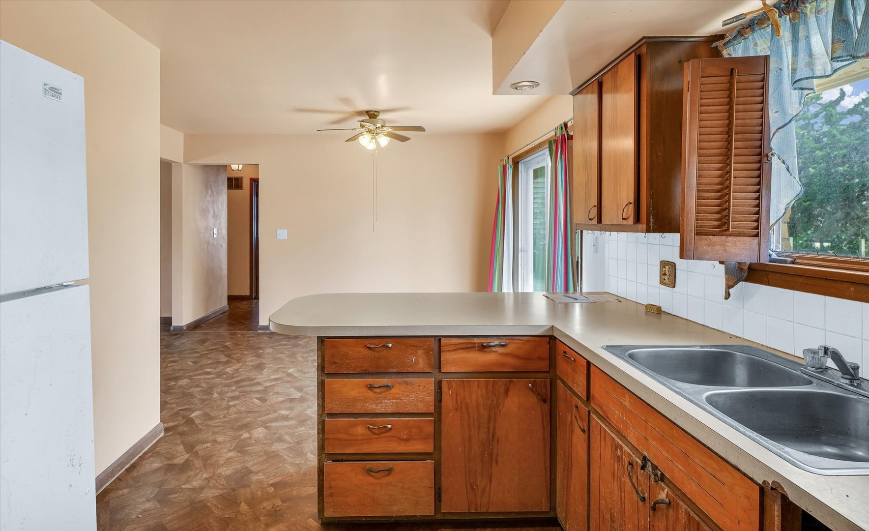 1512 Locust Avenue Rantoul, IL 61866 - Photo 15 of 39 a kitchen with a sink and a refrigerator