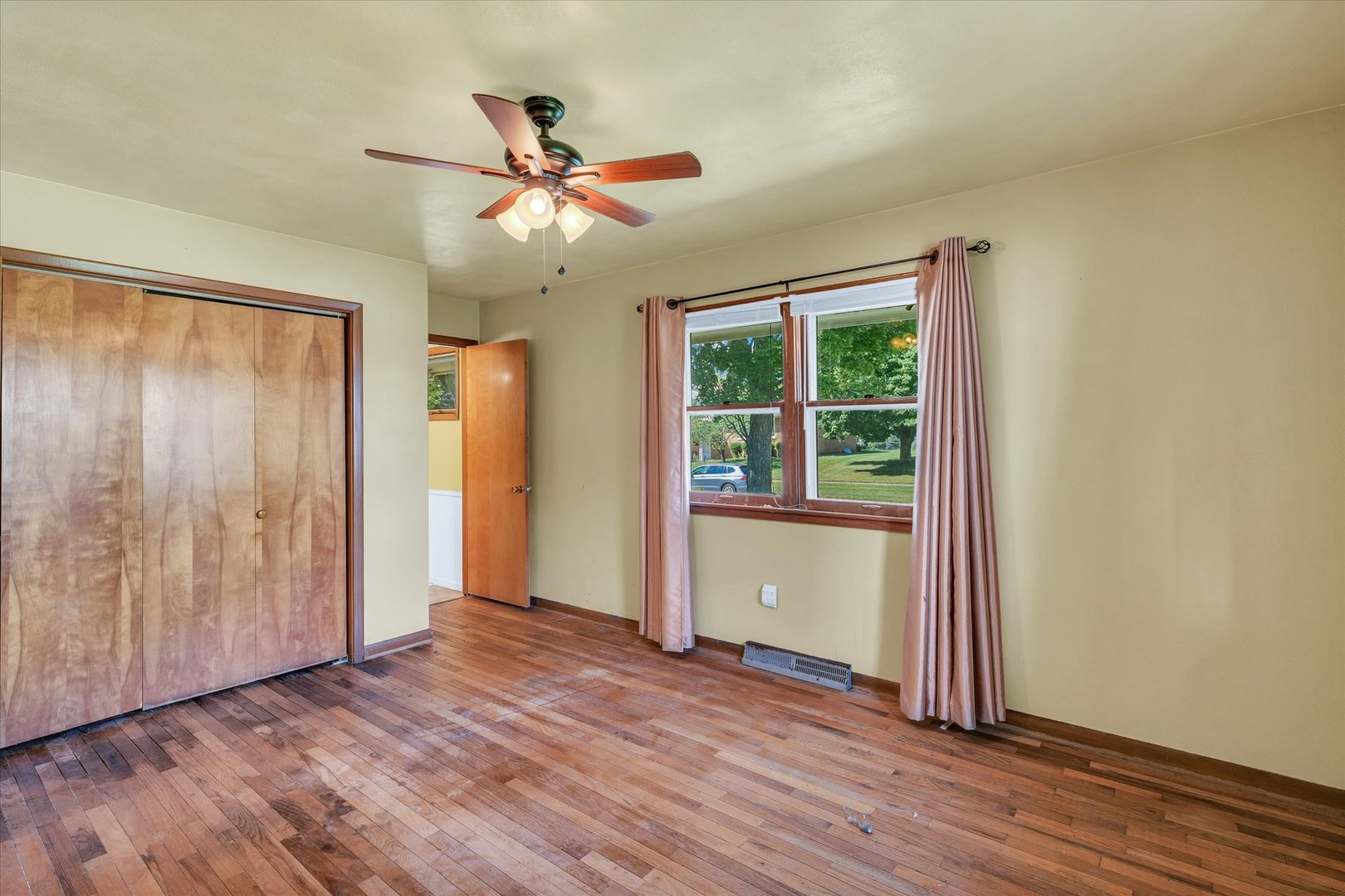 1512 Locust Avenue Rantoul, IL 61866 - Photo 18 of 39 wooden floor in an empty room with a window