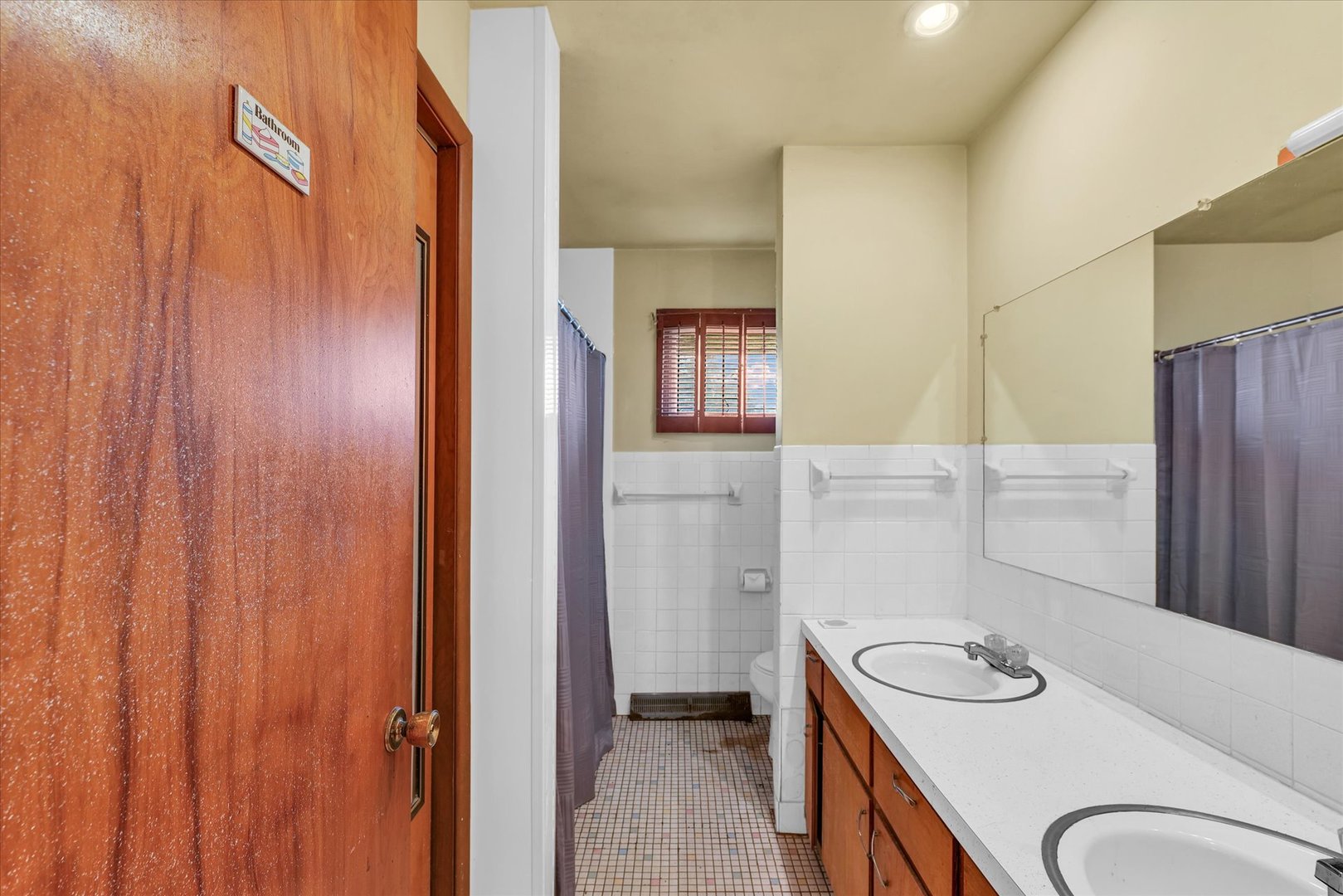 1512 Locust Avenue Rantoul, IL 61866 - Photo 24 of 39 a bathroom with a granite countertop sink and a mirror