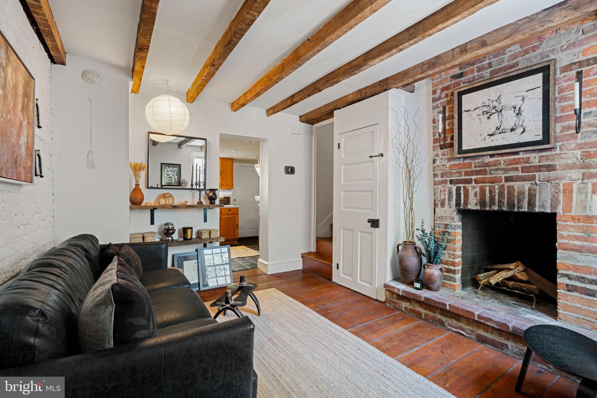 142 Carpenter Street Philadelphia, PA 19147 - Photo 6 of 49 a living room with furniture and a fireplace