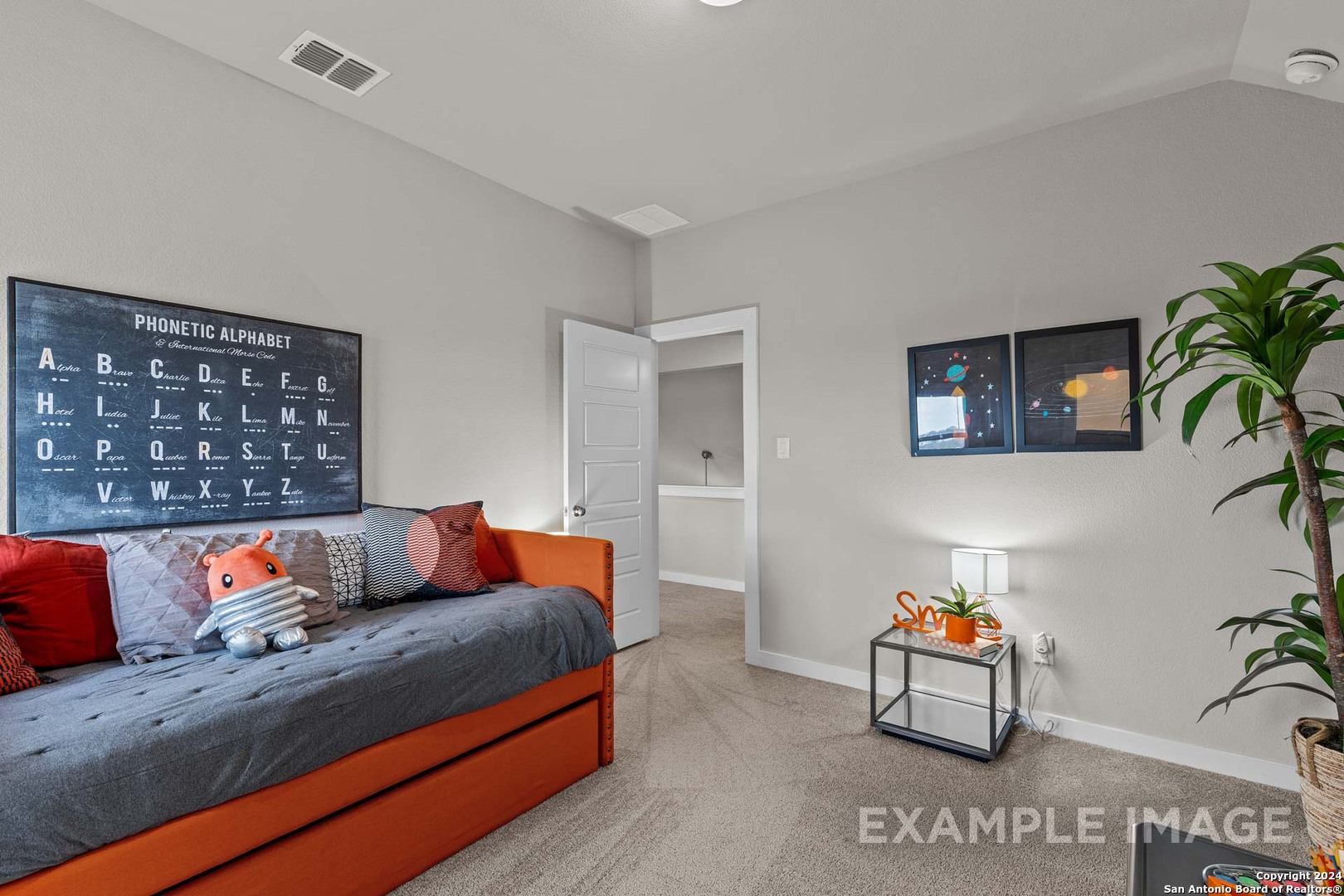 429 Tims Way Seguin, TX 78155 - Photo 44 of 50 a bedroom with furniture and a potted plant