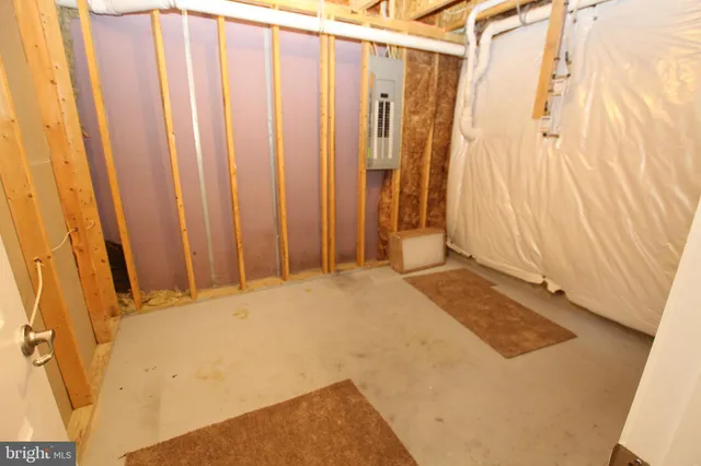 a bathroom with a shower curtain and a window
