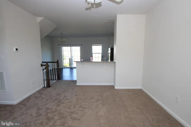 a view of a kitchen with a sink and cabinets