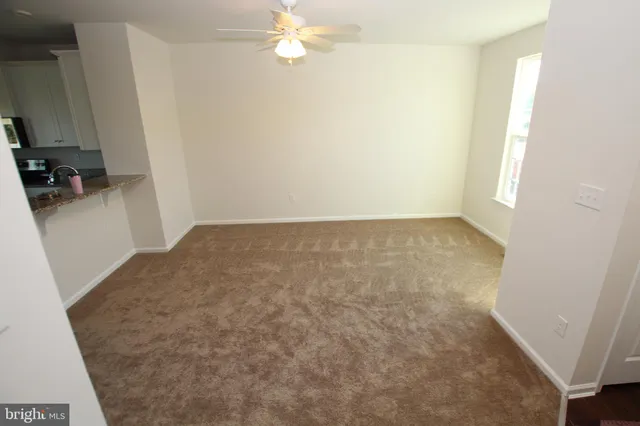 an empty room with a fireplace