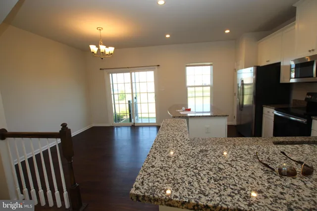 a living room with fireplace furniture and a flat screen tv