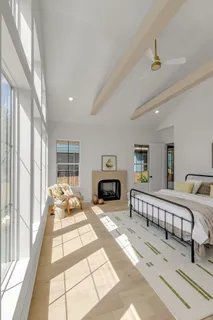 a en suite bathroom with a double vanity sink and a mirror