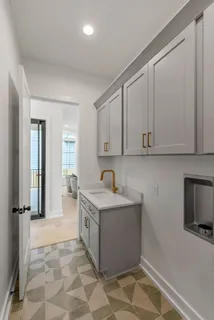 a bathroom with a granite countertop toilet sink and mirror