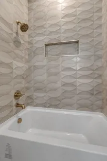 a view of an empty room with wooden floor and closet