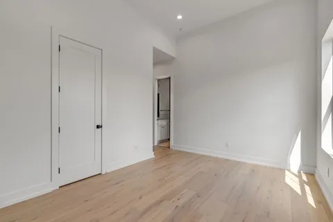 a view of an empty room with a fan