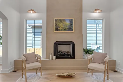 a large kitchen with cabinets and wooden floor
