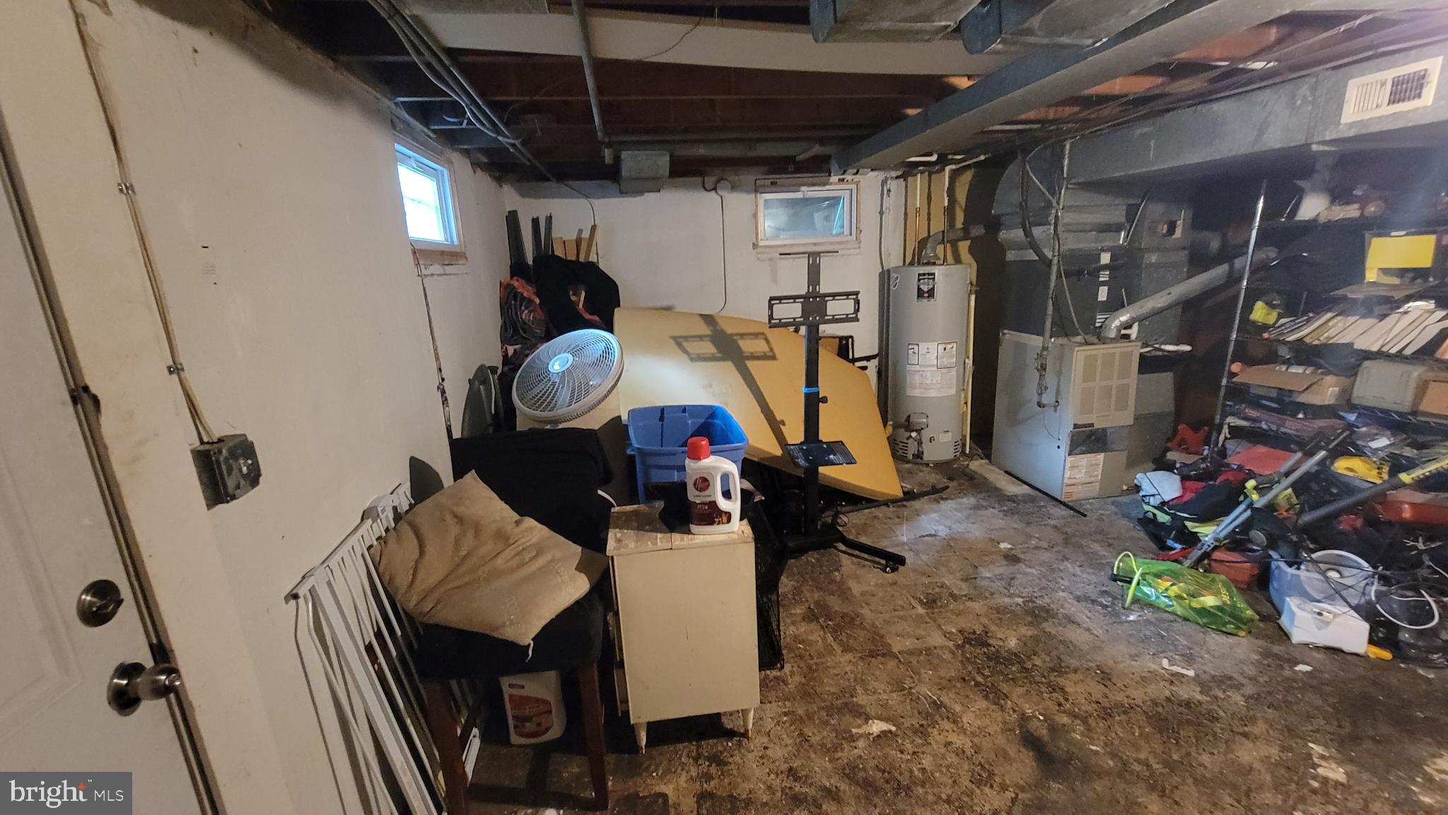 5105 Plymouth Road Baltimore, MD 21214 - Photo 15 of 29 Cluttered basement with potential for renewal.