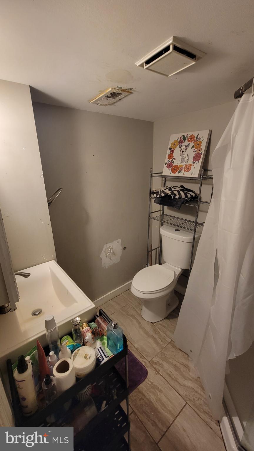 5105 Plymouth Road Baltimore, MD 21214 - Photo 21 of 29 Cozy bathroom with modern touches.