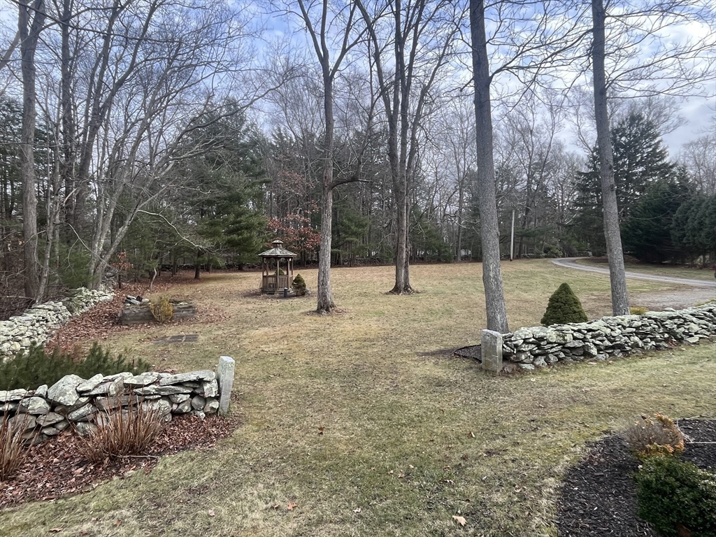 985 Glebe Street Taunton, MA 02780 - Photo 19 of 23 a backyard of a house with lots of green space