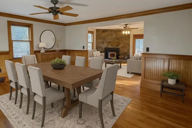 a view of a dining room with furniture window and wooden floor