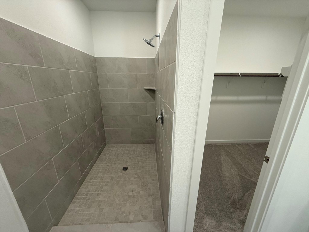 9315 Zander Drive Baytown, TX 77521 - Photo 13 of 21 a bathroom with a glass shower door