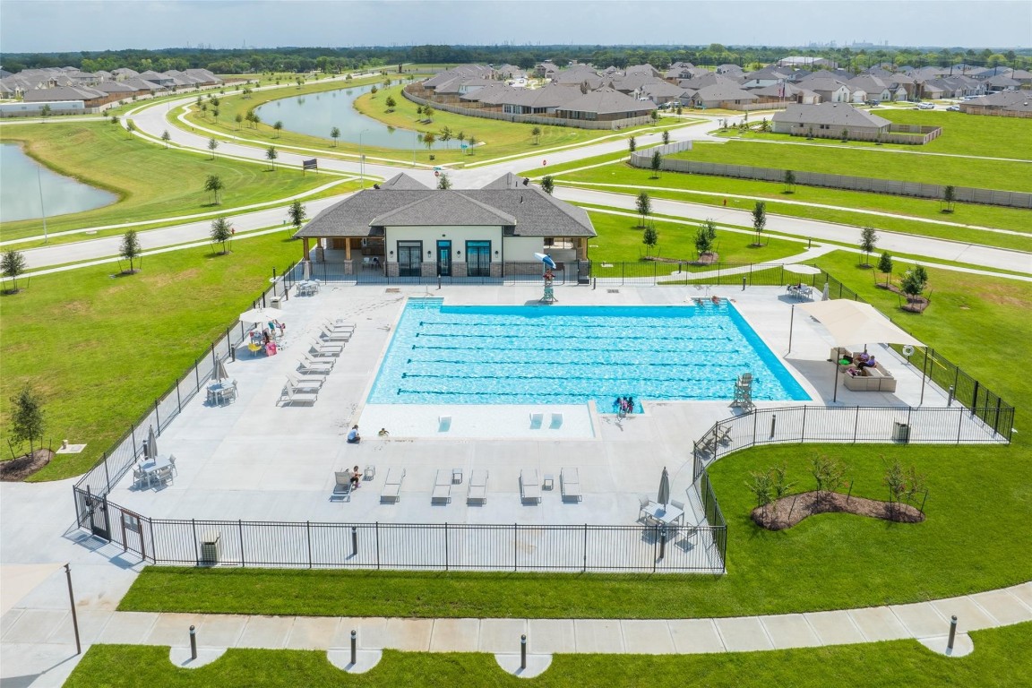 9315 Zander Drive Baytown, TX 77521 - Photo 18 of 21 an aerial view of a swimming pool with a yard