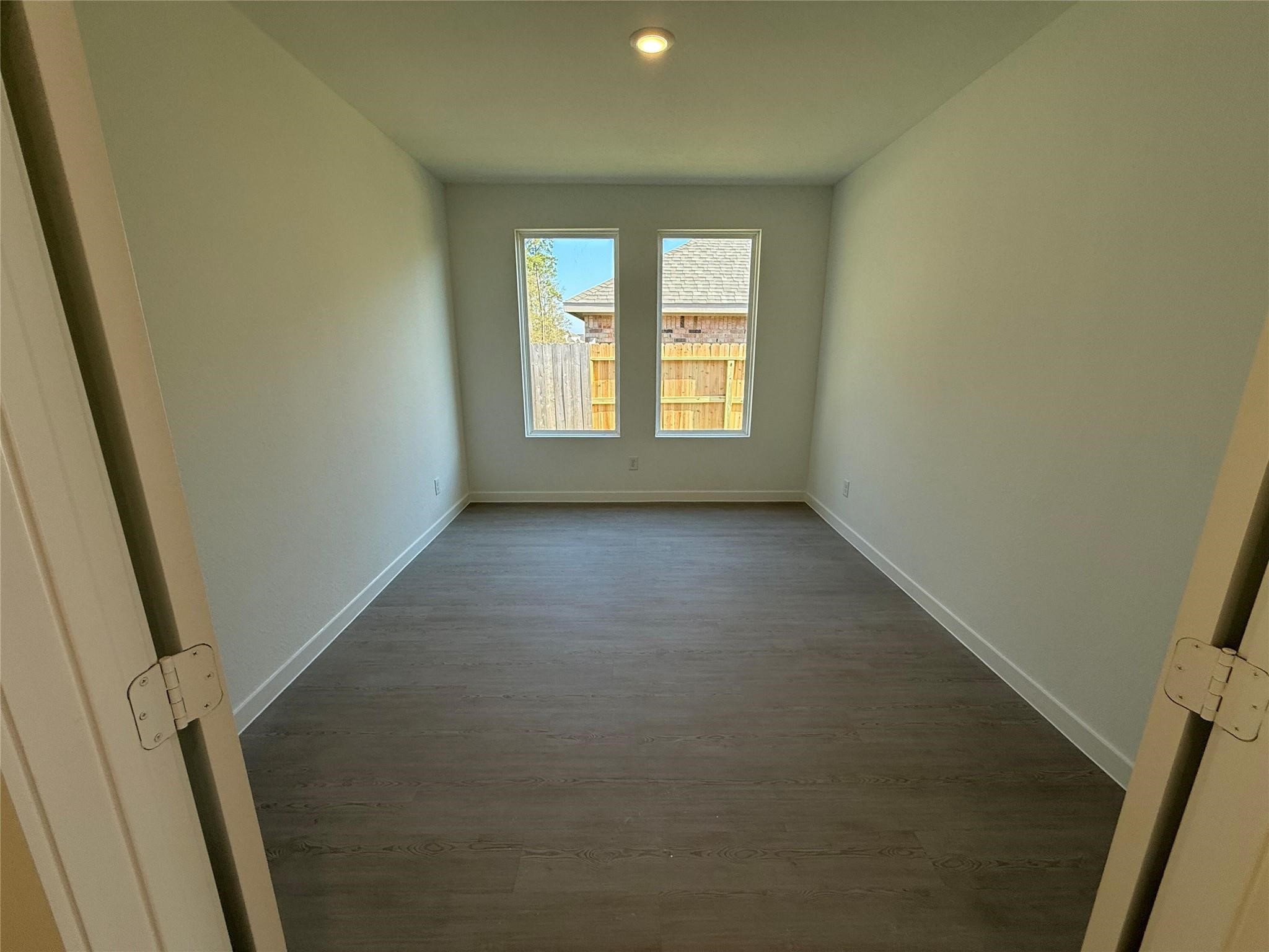 9315 Zander Drive Baytown, TX 77521 - Photo 8 of 21 an empty room with windows
