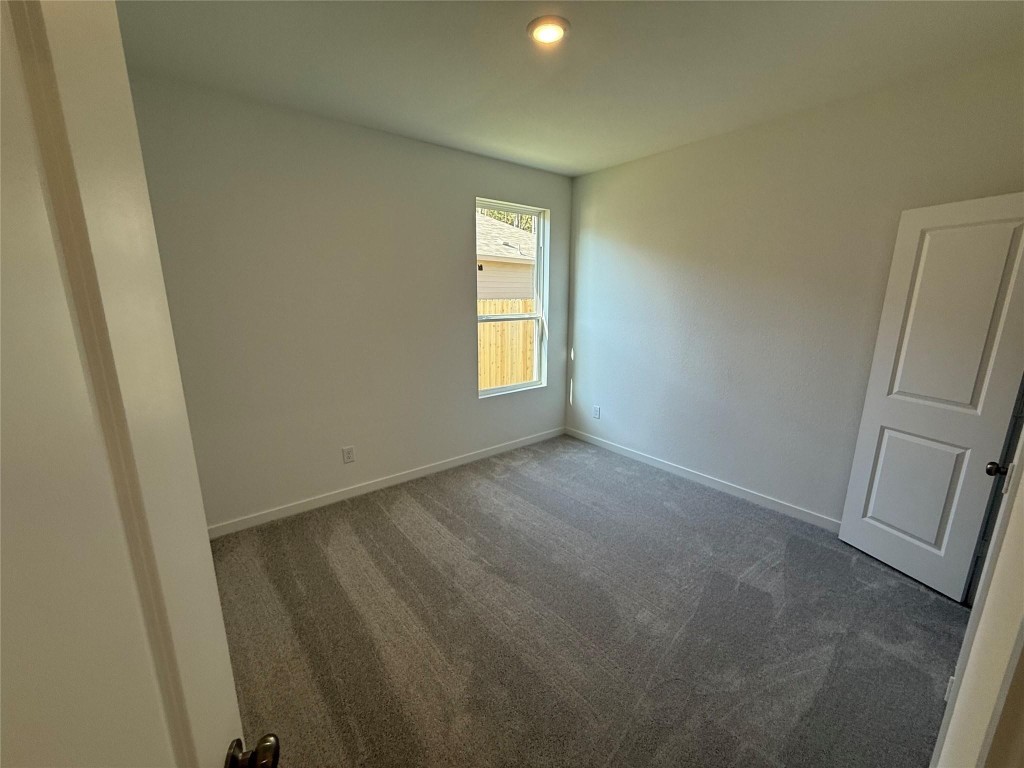 9315 Zander Drive Baytown, TX 77521 - Photo 9 of 21 a view of empty room with windows
