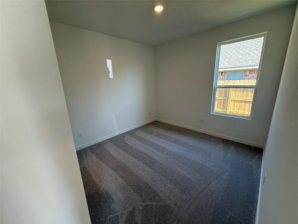 9315 Zander Drive Baytown, TX 77521 - Photo 10 of 21 an empty room with a window