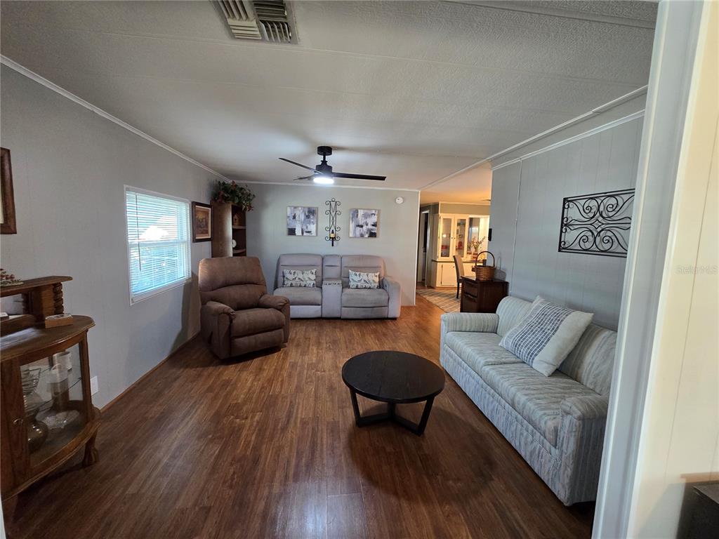 1535 Caribbean Road Sebring, FL 33870 - Photo 12 of 26 a living room with furniture and a wooden floor
