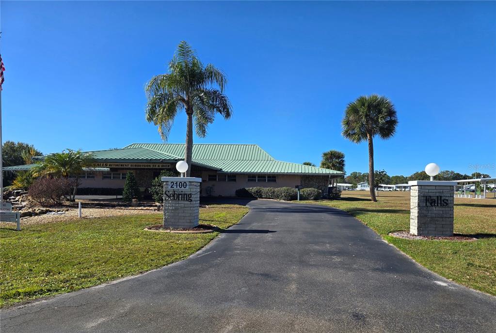 1535 Caribbean Road Sebring, FL 33870 - Photo 25 of 26 a swimming pool with outdoor seating and yard