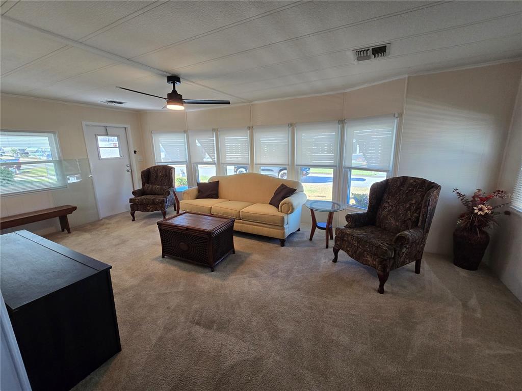 1535 Caribbean Road Sebring, FL 33870 - Photo 10 of 26 a living room with furniture and a large window