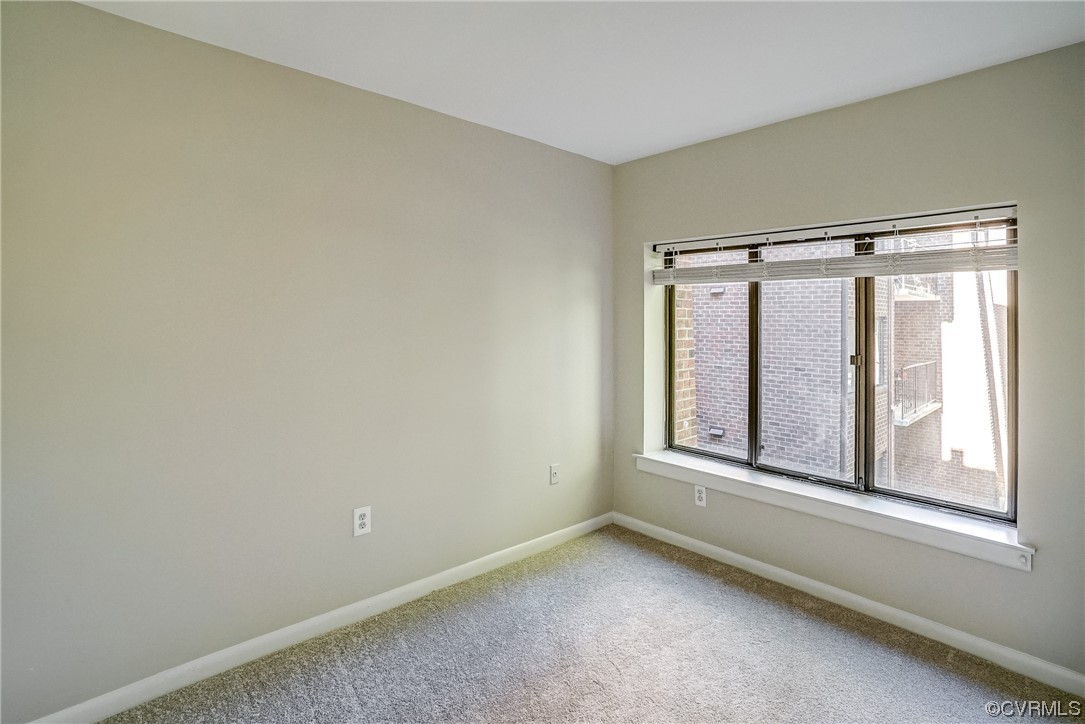1501 Thistle Road, Unit 103 Henrico, VA 23238 - Photo 14 of 27 a view of an empty room with a window