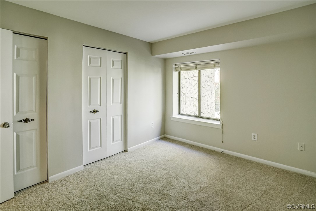 1501 Thistle Road, Unit 103 Henrico, VA 23238 - Photo 17 of 27 a view of an empty room with a window