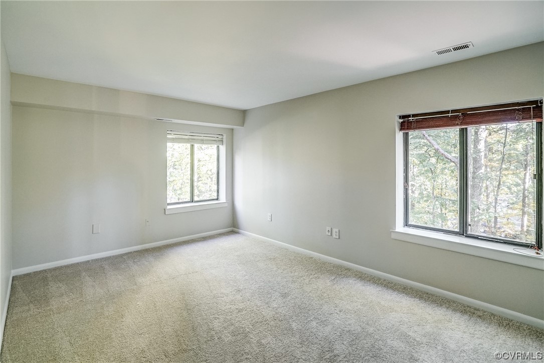 1501 Thistle Road, Unit 103 Henrico, VA 23238 - Photo 21 of 27 an empty room with windows