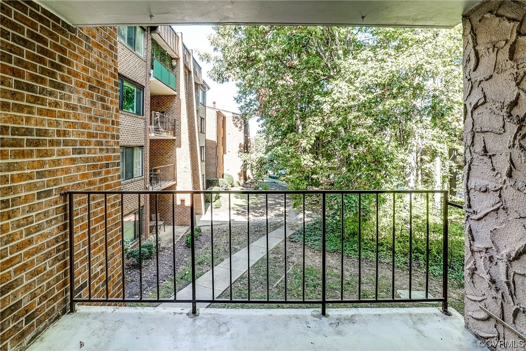 1501 Thistle Road, Unit 103 Henrico, VA 23238 - Photo 24 of 27 a view of a balcony with a floor to ceiling window and tree