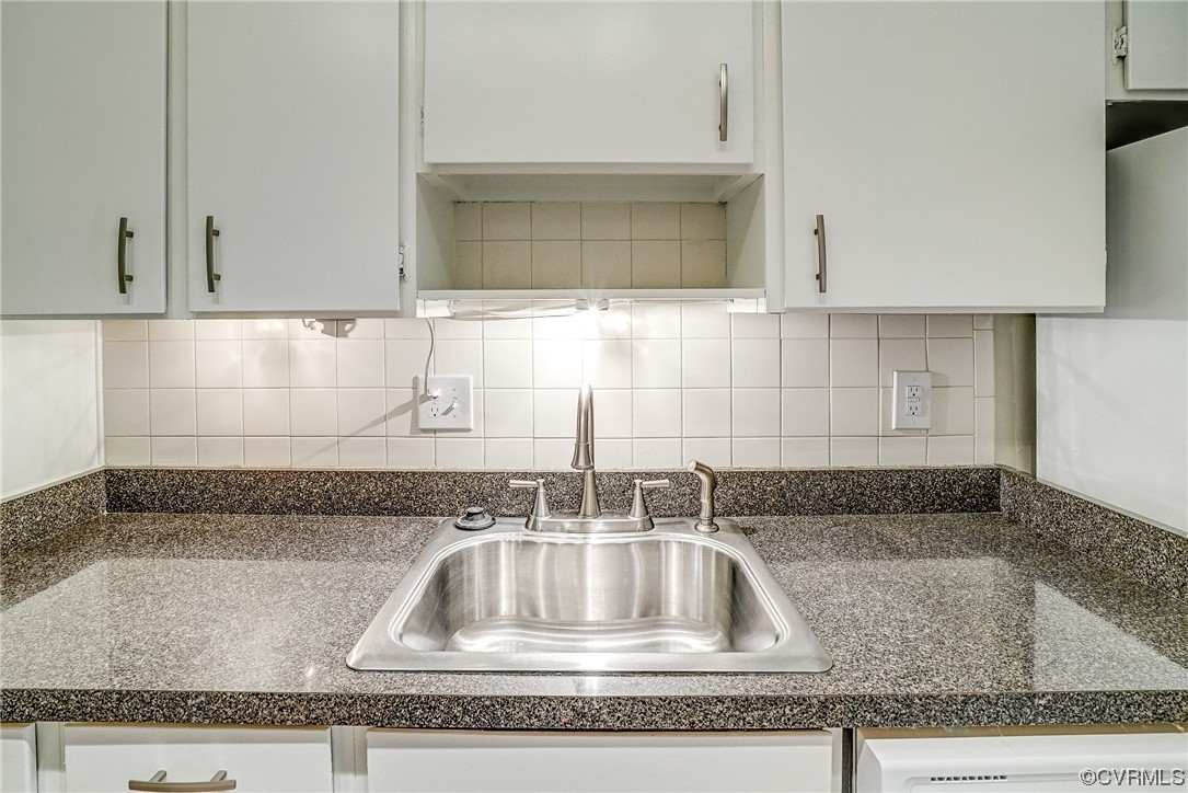 1501 Thistle Road, Unit 103 Henrico, VA 23238 - Photo 9 of 27 a kitchen with granite countertop a sink and a granite counter tops