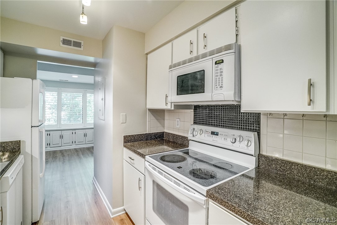 1501 Thistle Road, Unit 103 Henrico, VA 23238 - Photo 10 of 27 a kitchen with white cabinets and appliances