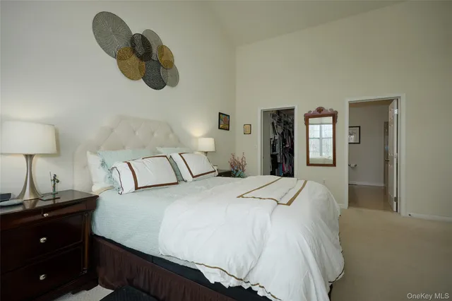 a bedroom with a bed and a lamp