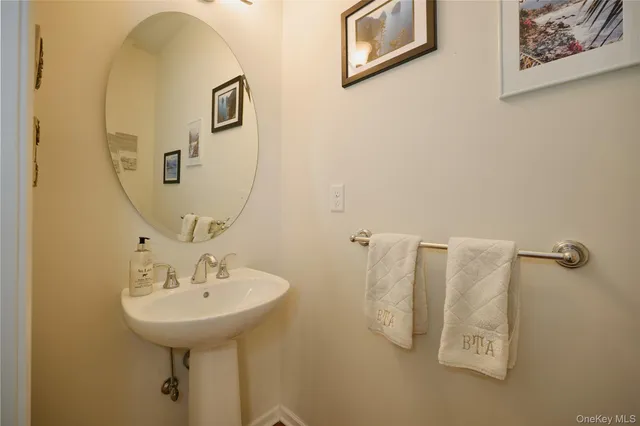 a bathroom with a sink and mirror